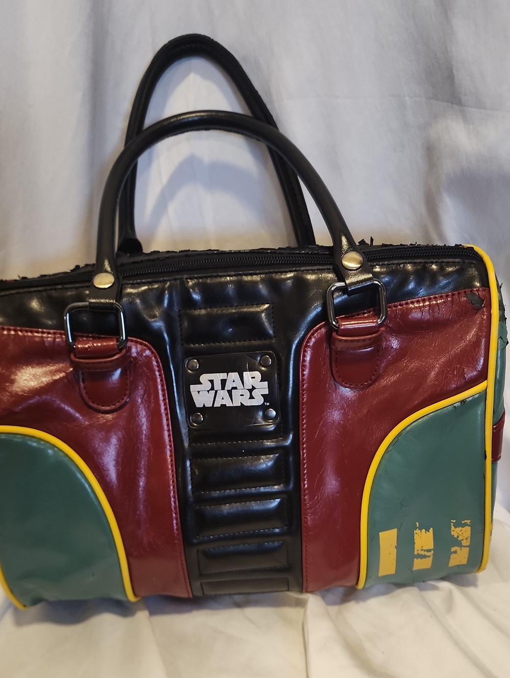 Star Wars Boba Fett bowler-style handbag featuring a green, red, and black color